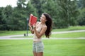 beautiful brunette woman and holds book Royalty Free Stock Photo