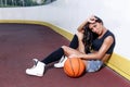 Beautiful brunette woman playing basketball on court outdoor Royalty Free Stock Photo