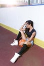 Beautiful brunette woman playing basketball on court outdoor Royalty Free Stock Photo