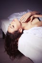Beautiful Brunette Woman Portrait on Bed Home Royalty Free Stock Photo