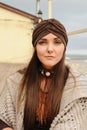 Beautiful brunette woman portrait dressed in jersey turban, autumn fashion concept