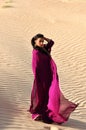 Beautiful brunette woman posing in arabic desert Royalty Free Stock Photo