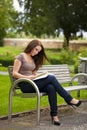 Beautiful brunette woman reading a book