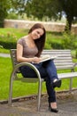 Beautiful brunette woman reading a book