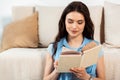 Beautiful brunette woman reading book at Royalty Free Stock Photo