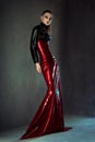 Beautiful brunette woman in red and black latex Royalty Free Stock Photo