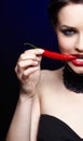 Beautiful brunette woman with red chilli pepper Royalty Free Stock Photo
