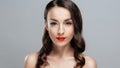 Beautiful brunette woman with red lipstick on lips. Close-up girl with beautiful make-up. Royalty Free Stock Photo