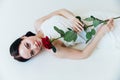 Beautiful young brunette woman with red rose Royalty Free Stock Photo