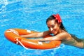 Beautiful brunette woman in a swimming pool Royalty Free Stock Photo