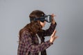 Beautiful brunette woman testing virtual reality helmet Royalty Free Stock Photo