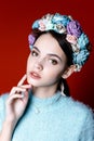 Beautiful brunette woman with a wreath of flowers on her head. Royalty Free Stock Photo