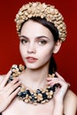 Beautiful brunette woman with a wreath of flowers on her head. Royalty Free Stock Photo