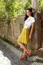Beautiful brunette in yellow skirt Royalty Free Stock Photo