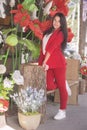 Beautiful brunette young woman, dressed in red classic tweed jacket and white shirt Royalty Free Stock Photo