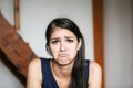 Beautiful brunette young woman with sad face Royalty Free Stock Photo