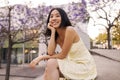 Beautiful brunette young woman smiling and look away in the park Royalty Free Stock Photo