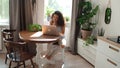 Charming young woman typing on laptop computer at home. Royalty Free Stock Photo