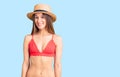 Beautiful brunette young woman wearing bikini with a happy and cool smile on face Royalty Free Stock Photo