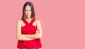 Beautiful brunette young woman wearing casual clothes skeptic and nervous, disapproving expression on face with crossed arms Royalty Free Stock Photo