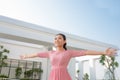 Beautiful brunette young woman wearing dress and walking on the Royalty Free Stock Photo