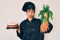 Beautiful brunettte woman chef cooking carrot cake depressed and worry for distress, crying angry and afraid