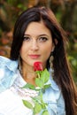 Beautiful brunnette with red rose Royalty Free Stock Photo