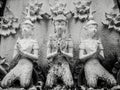 Beautiful buddhist sculpture hands clasped in prayer, detail of buddhist figures carved in Wat Sanpayangluang at Lamphun, Thailand Royalty Free Stock Photo