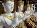 Beautiful buddhist sculpture hands clasped in prayer, detail of buddhist figures carved in Wat Sanpayangluang at Lamphun, Thailand Royalty Free Stock Photo