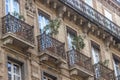 Beautiful building details. Ornate facade with iron balconies. Toulouse, France