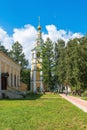 Russia, Uglich, July 2020. High bell tower of the Epiphany Church among the trees of the park.