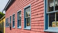 Beautiful buildings with blue windows on the colorful wall in Prince Edward Island, Canada