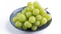 Beautiful a bunch of Shine Muscat green grape on a blue plate isolated on white background Royalty Free Stock Photo