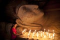 A beautiful Burmese girl to pay her respect to the Buddha statue.