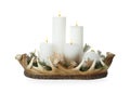 Beautiful burning candles with Christmas decor in basket on white background Royalty Free Stock Photo