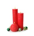 Beautiful burning candles with Christmas decor on white background Royalty Free Stock Photo