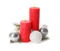 Beautiful burning candles with Christmas decor on white background Royalty Free Stock Photo