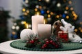 Beautiful burning candles and Christmas decor on white table indoors Royalty Free Stock Photo