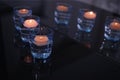 Beautiful burning candles on dark table