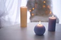 Beautiful burning candles on wooden table indoors