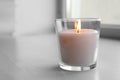 Beautiful burning wax candle in glass Royalty Free Stock Photo