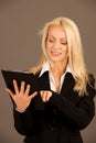 Beautiful busienss woman browsing web on her tablet Royalty Free Stock Photo