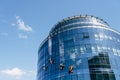 A beautiful business center with blue mirrored windows. Window cleaning service cleans windows from dirt. Royalty Free Stock Photo