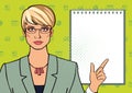 Beautiful business lady in a suit points to a blank notebook. Mock up for text Royalty Free Stock Photo