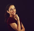 Beautiful business toothy enjoying laughing woman with long brown healthy curly hair style in dark red shirt clothing. Closeup Royalty Free Stock Photo