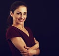 Beautiful business toothy enjoying laughing woman with long brown healthy curly hair style in dark red shirt clothing. Closeup Royalty Free Stock Photo