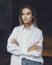 Beautiful business woman. Blonde in white shirt. Purposeful woman posing with crossed arms. female portrait.