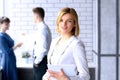 Beautiful business woman. business colleagues analyzing financial figures on a graphs