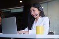 Beautiful business woman or call center workers in headphones for communication and consulting people. Support concept Royalty Free Stock Photo