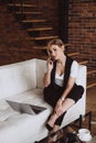 Beautiful business woman decides issues by talking on the phone. Soft selective focus, defocus